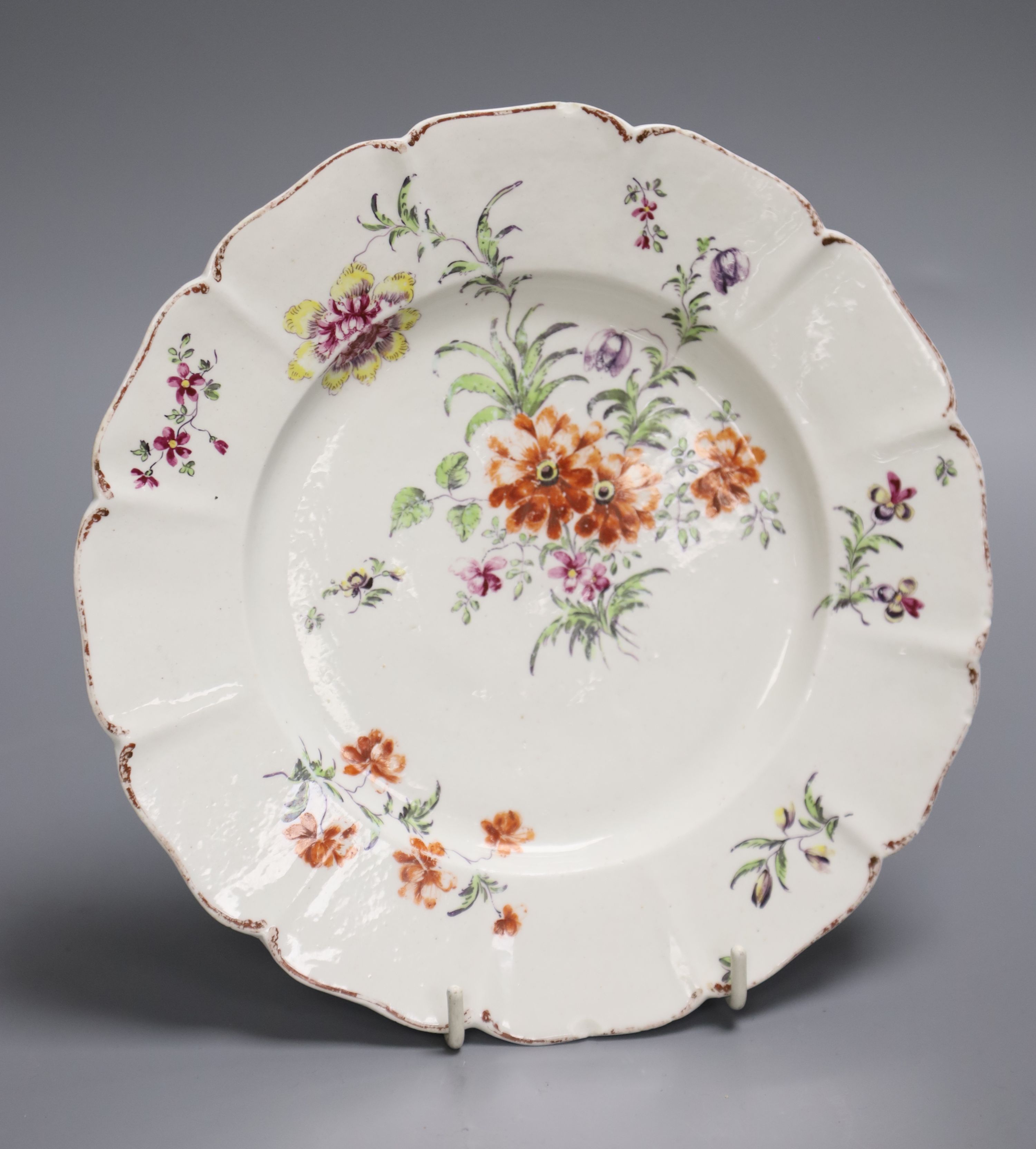 An 18th century Derby shaped plate painted with flower in the manner of the Cotton Stem painter, diameter 22cm